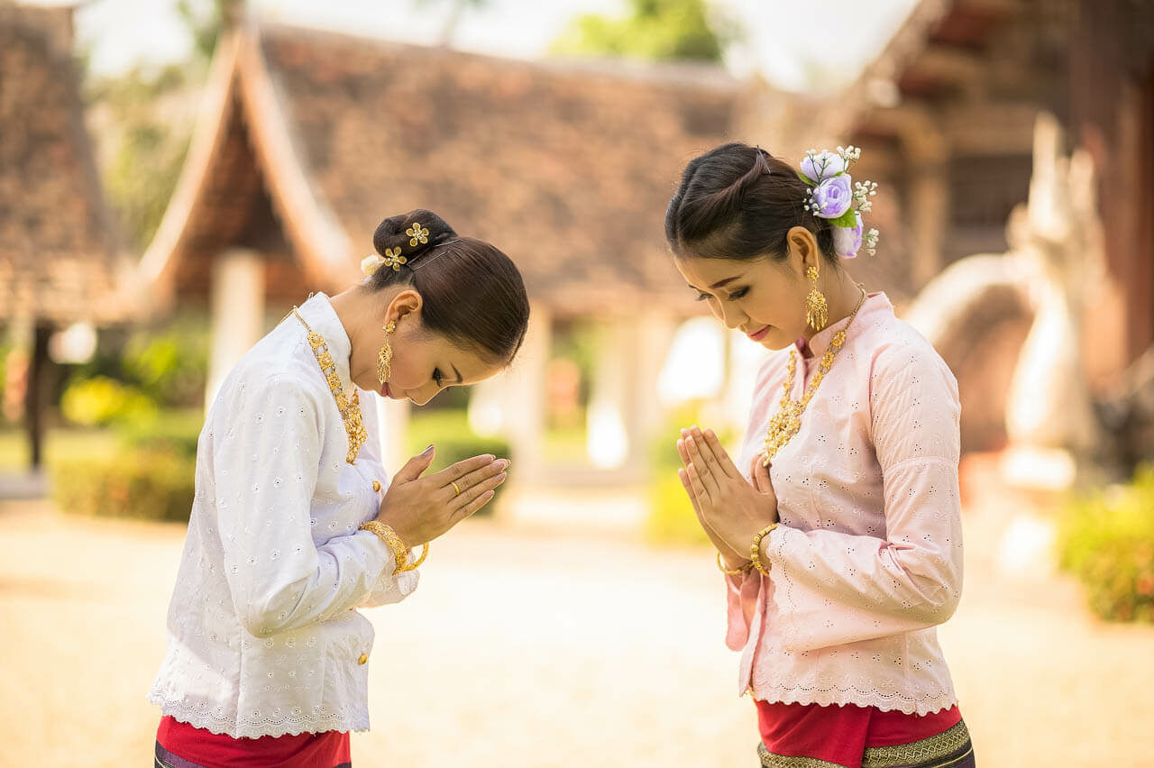 For instance, always greet with a "wai" (a slight bow with palms together)